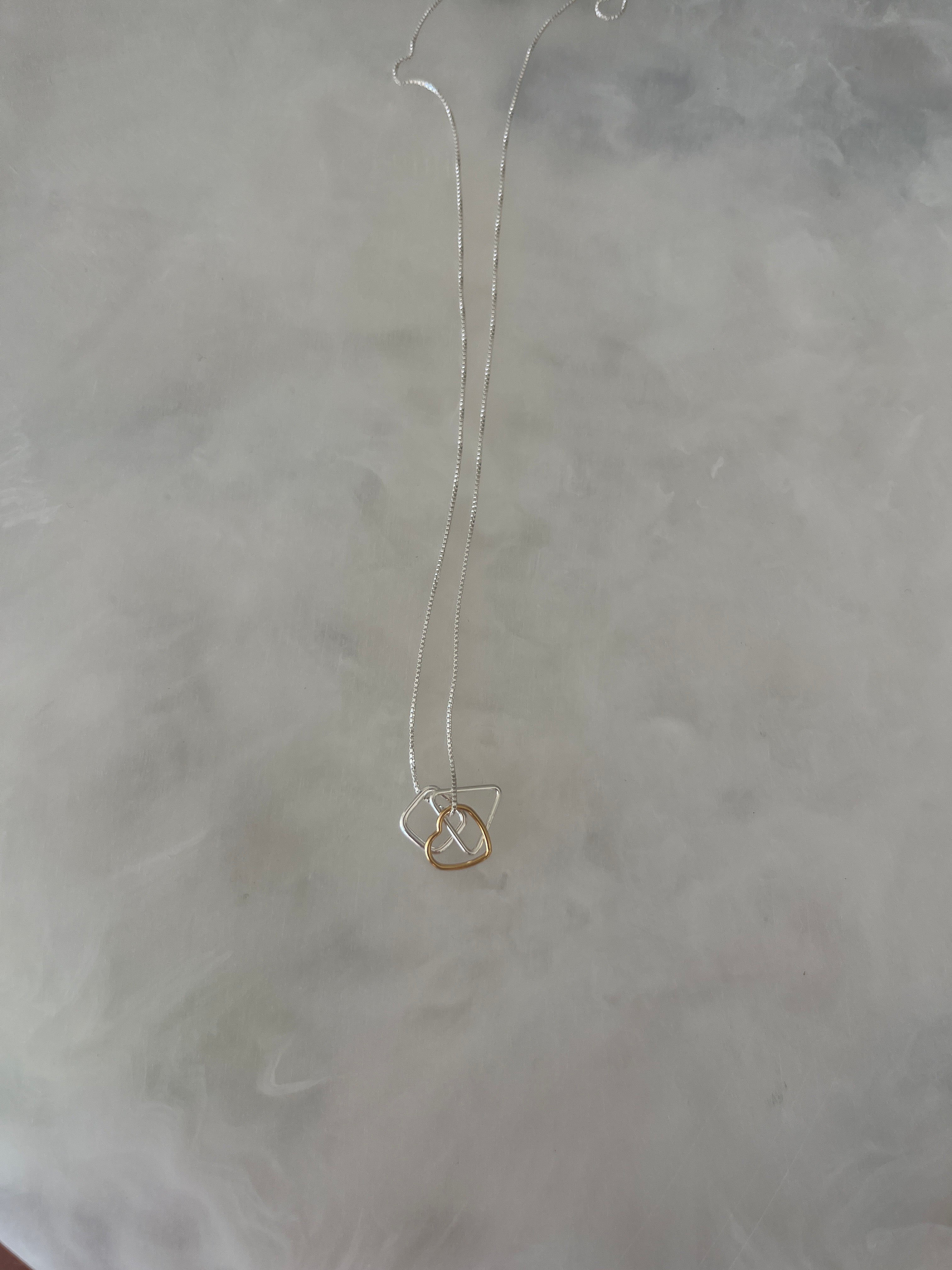 Silver Necklace With Silver & Gold Layered Pendants.