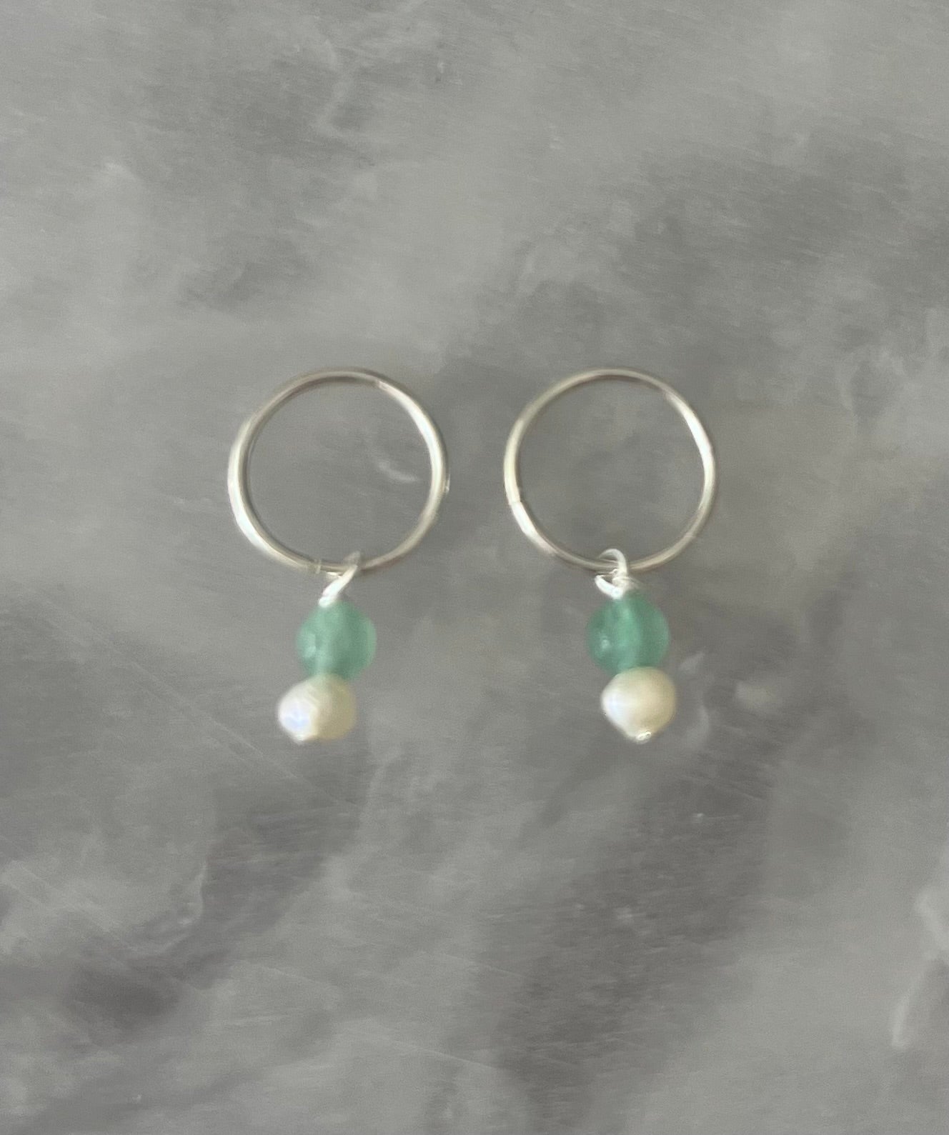 Solid silver sleepers with green gemstones and pearls.