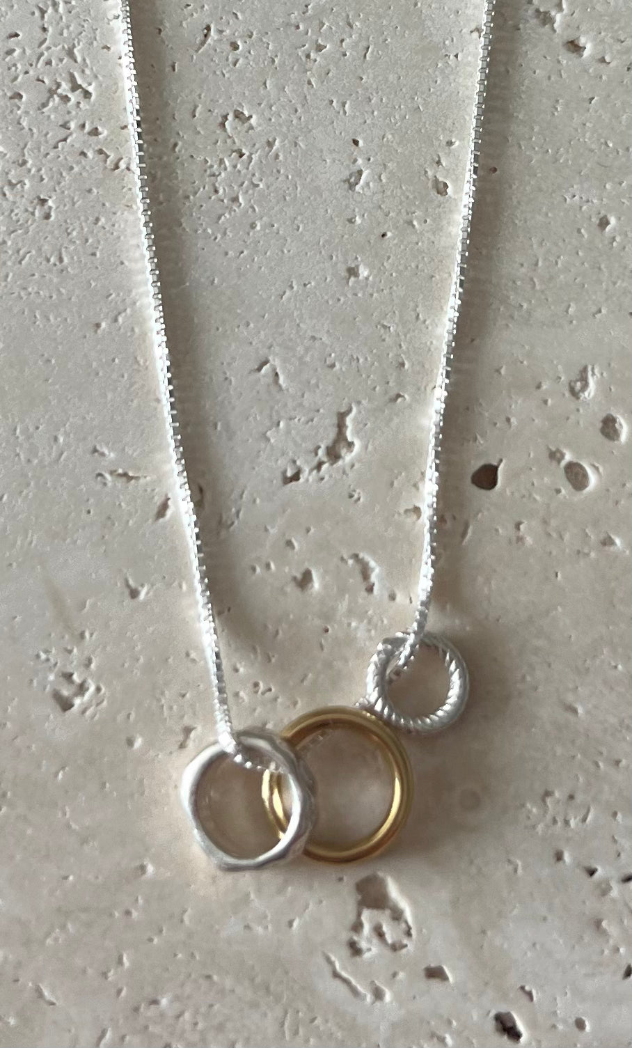 Silver Three Loop Necklace Features Gold and Silver.