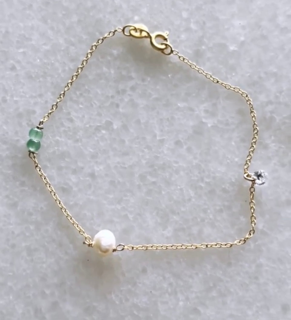 Gold bracelet with gems