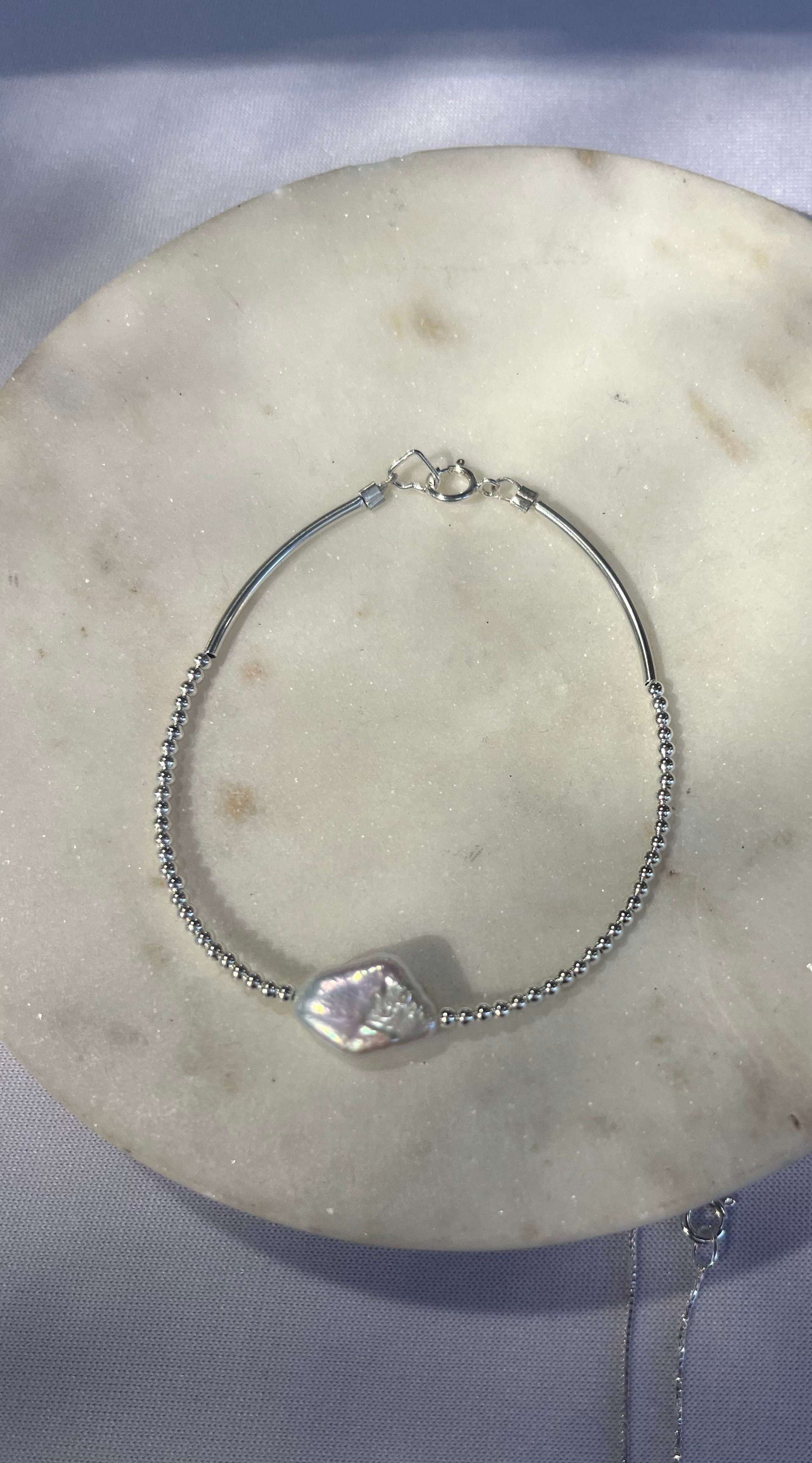 Silver and diamond shape pearl bracelet
